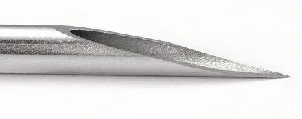 a close up of a piercing needle to demonstrate that its sharp and to show its hollow
