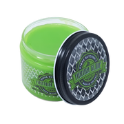 A green tub of Mamba Glide tattoo aftercare cream