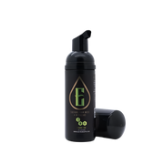 A black pump bottle with a green and yellow label, branded as 'Electrum', containing tattoo aftercare solution.