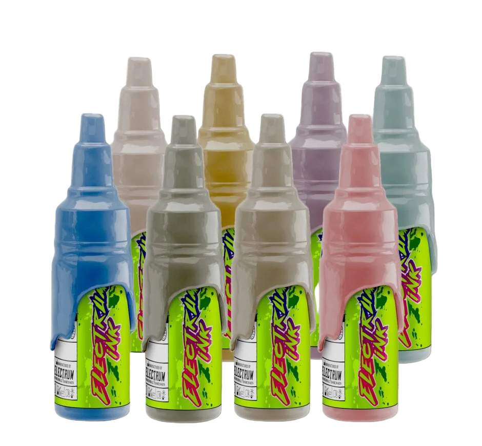A set of various colored tattoo ink bottles, labeled with the Electrum brand and Janelle Hanson's Cowpoke collection.