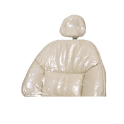 A beige half chair cover made of plastic material, designed to provide a protective barrier on a chair.