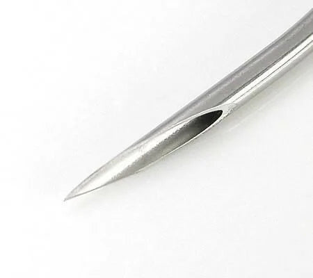 A closeup of a piercing needle to demonstrate how sharp the needle is, its hollow nature and how long the taper of the needle is 
