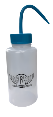 A clear Nalgene squeeze bottle with a blue cap 