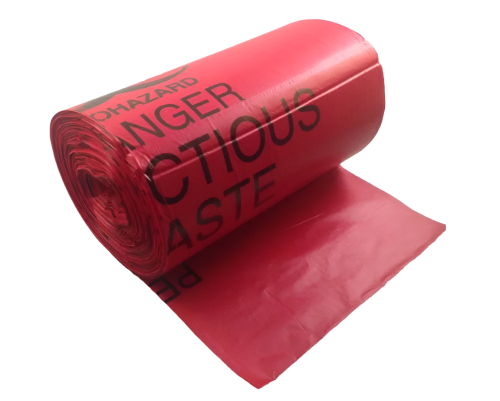 A roll of red biohazard waste disposable bags with the words 'Hazardous Waste' printed in black.