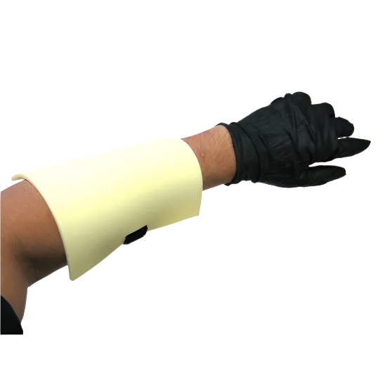 An arm with the white practice skin wrapped around it - demonstrating how you could use the sheet to practice tattooing 