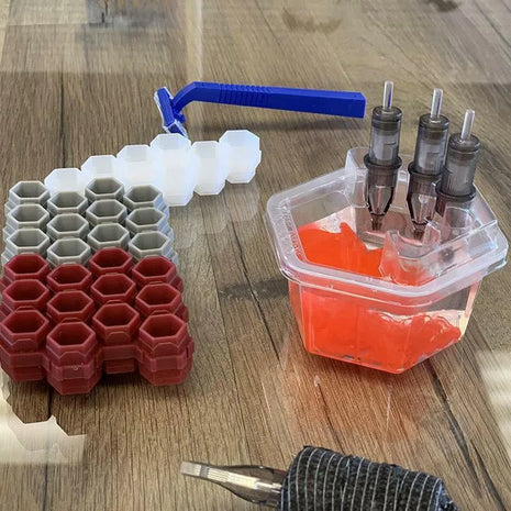 hive cup for water and cartridges showing cartridges in water, hive caps, machine and other set up things
