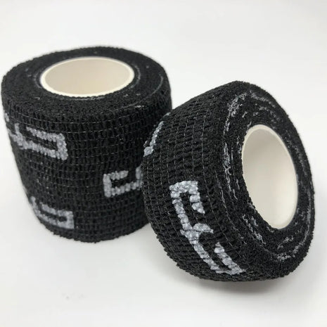 Two rolls of black cohesive wrap grip tape with the Electrum brand logo visible