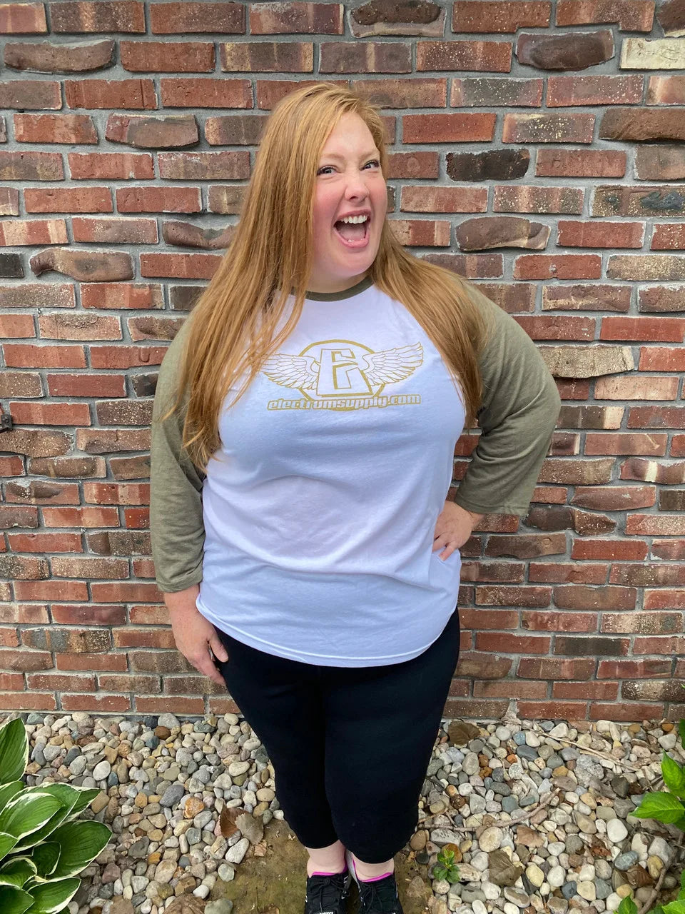 a woman wearing the electrum 3/4 sleeve baseball style shirt 