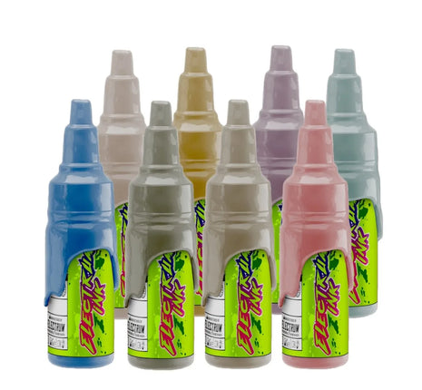 A set of various colored tattoo ink bottles, labeled with the Electrum brand and Janelle Hanson's Cowpoke collection.