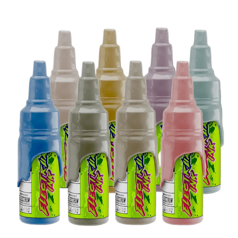 A set of various colored tattoo ink bottles, labeled with the Electrum brand and Janelle Hanson's Cowpoke collection.