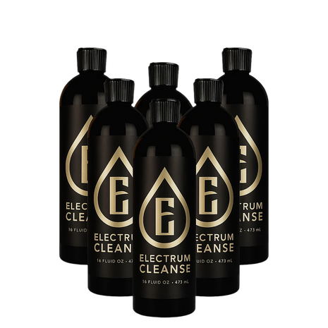Set of black bottles with gold logo and text on a white background