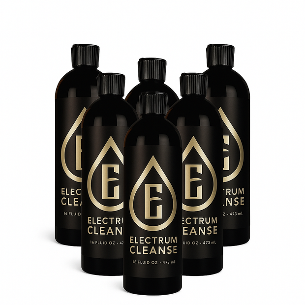 Set of black bottles with gold logo and text on a white background