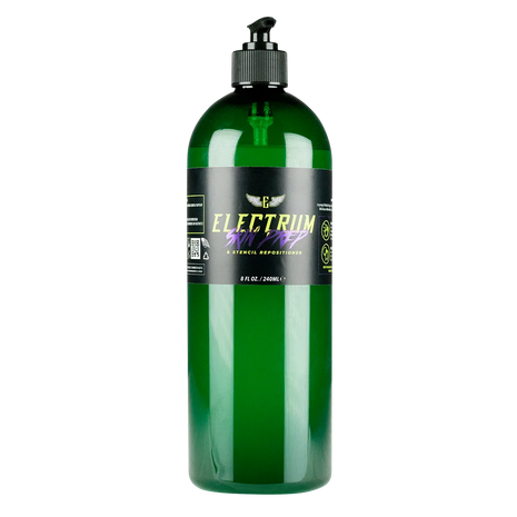 A green bottle of Electrum Premium Tattoo Skin Prep and Stencil Repositioner with a pump dispenser