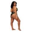 Woman wearing a black and green bikini with the flying e electrum brand logo 