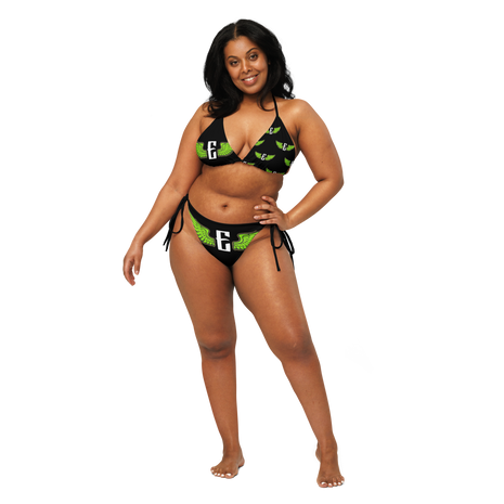 Woman wearing a black and green bikini with the flying e electrum brand logo 