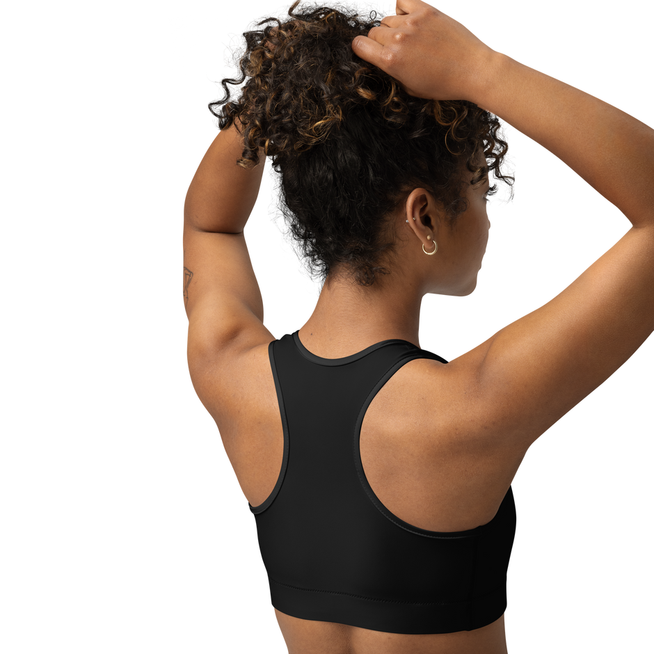 Person wearing a black sports bra from electrum supply