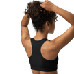 Person wearing a black sports bra from electrum supply