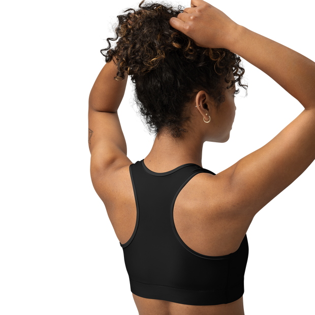 Person wearing a black sports bra from electrum supply