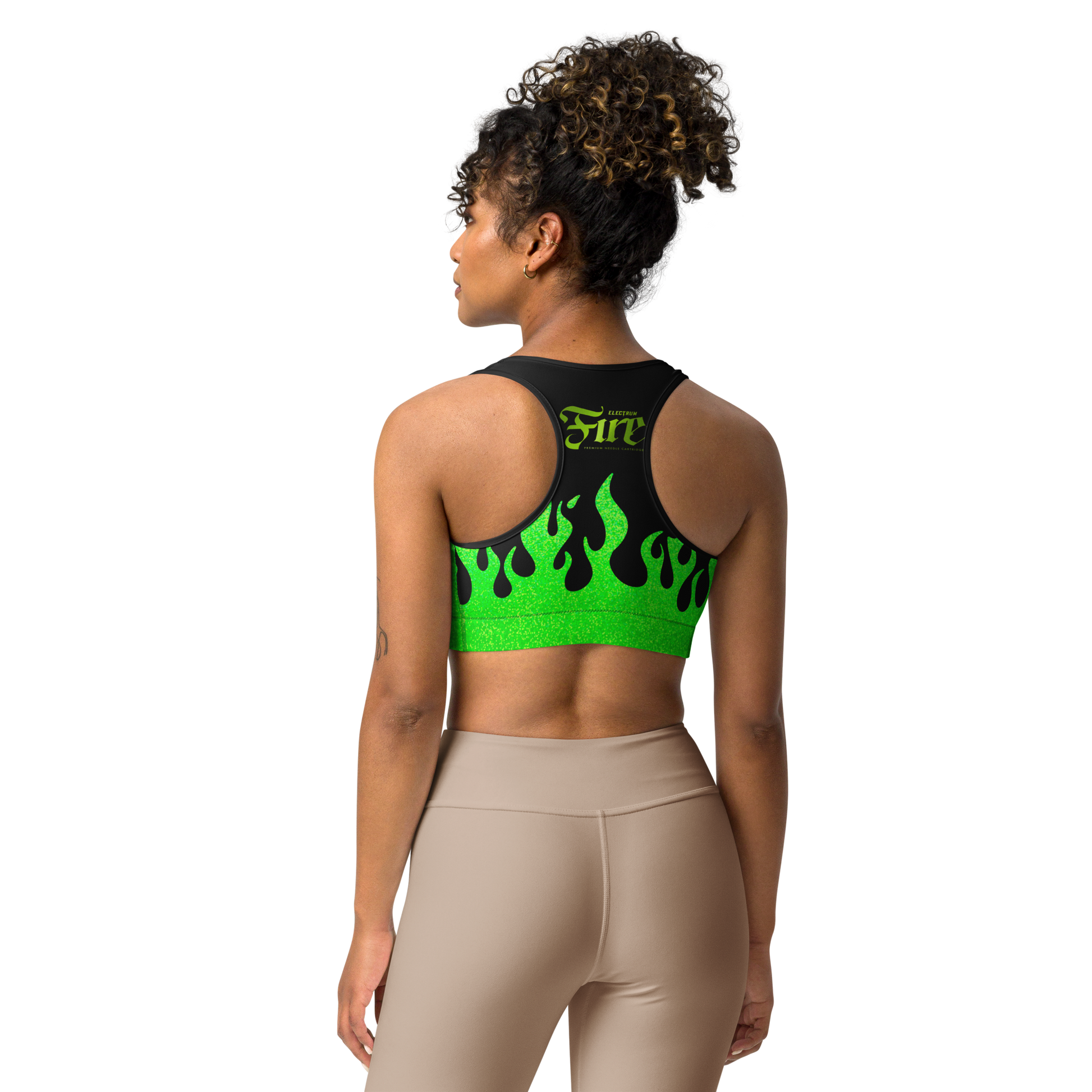 person wearing a black and green sports bra with a fire logo and fire print
back