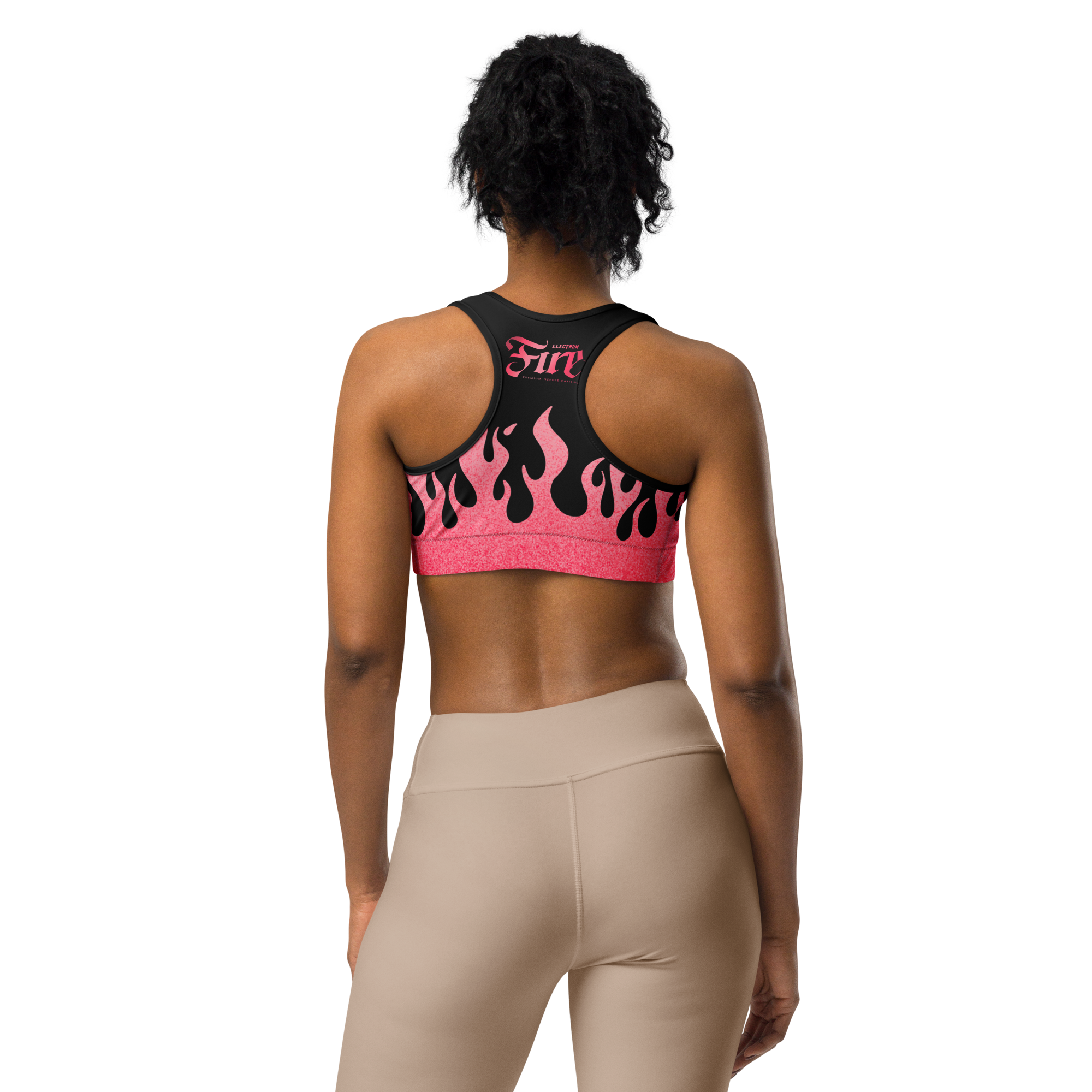 Person wearing a pink and black sports bra with flames and a fire cartridge logo on back