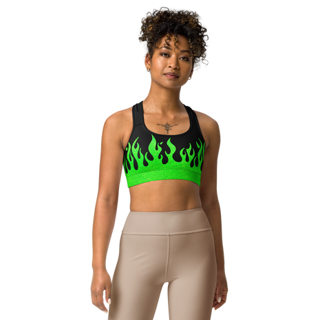 person wearing a black and green sports bra with a fire logo and fire print
