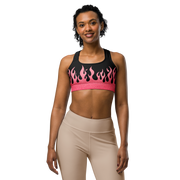 Woman wearing a black sports bra with pink flames 