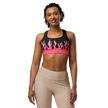 Woman wearing a black sports bra with pink flames 
