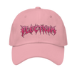 pink metal style lettering saying electrum on a pink hat 