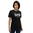 Person wearing a black t-shirt with white text saying electrum tattoo supply in a metal inspired font