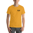 Person wearing a mustard yellow  t-shirt with a black electrum metal lettering logo on the chest