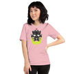 Person wearing a pink t-shirt with a black cat graphic on a white background Badtz-Maru black tee abracassdabra 