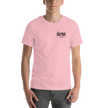 Person wearing a pink t-shirt with a black electrum metal lettering logo on the chest